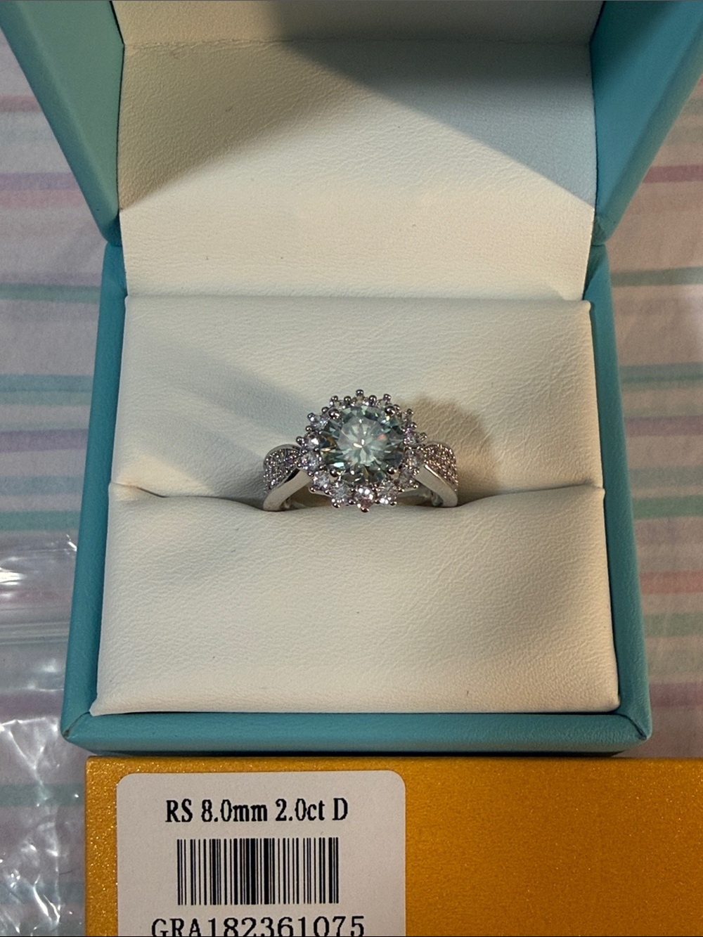 Halo Ring with Light Blue Center Stone